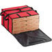 A red nylon Choice insulated pizza delivery bag with black trim holding four pizza boxes.