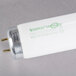 A close up of a white Satco T12 fluorescent tube.