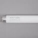 A white Satco T8 fluorescent tube light with green text on it.