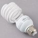 A Satco cool white spiral compact fluorescent light bulb.