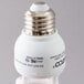 A close up of a Satco Cool White Compact Fluorescent Light Bulb with a silver top.