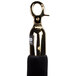 A black metal stanchion rope with brass ends.