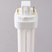 A close-up of a Satco Cool White pin-based compact fluorescent light bulb with a white plug and gold cap.