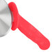 A Dexter-Russell pizza cutter with a red handle.