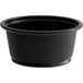 A Choice black plastic souffle cup on a white background.