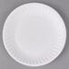 A 6" white paper plate with a wavy rim on a gray background.