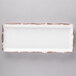A white rectangular melamine tray with a brown scalloped design.