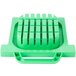 A green plastic pusher head with holes for blades.