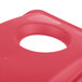 A red Rubbermaid Slim Jim recycling container lid with a hole in it.
