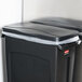 A black Rubbermaid Slim Jim rectangular trash can with a lid.