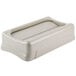 A beige rectangular Rubbermaid Slim Jim trash can lid with a swing top.