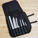 A Dexter-Russell V-Lo 7-piece cutlery set in a black case.