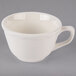 A Tuxton round white China cup with a scalloped edge and handle.