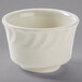 A white Tuxton china bowl with a swirl design on the rim.
