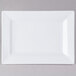 A white rectangular plate with a plain edge.