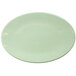 An Elite Global Solutions hemlock oval melamine plate with a light green border and white center.