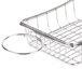 A stainless steel Clipper Mill wire basket with a handle and condiment holder.