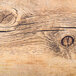 A rectangular serving board with a faux driftwood texture.