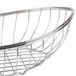 A stainless steel Clipper Mill boat basket with a handle.