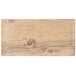 A GET Melamine faux oak wood charcuterie serving board with a wood surface.