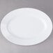 A white Elite Global Solutions oval melamine plate.