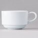 A close-up of a white Elite Global Solutions melamine cup with a handle.