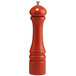 A Chef Specialties butternut orange pepper mill with a silver top.