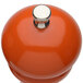 A close-up of a Chef Specialties Butternut Orange Pepper Mill with a metal knob.