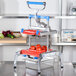 A Prince Castle Saber King fruit and vegetable dicer machine with diced tomatoes in it.