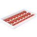 A red silicone tray with 24 raspberry-shaped molds.
