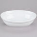 A white CAC oval serving bowl on a gray surface.
