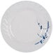 A white plate with blue and white bamboo design.