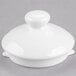A white Royal Rideau porcelain teapot lid with a small knob.
