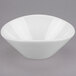 A close-up of a Libbey round white porcelain bowl with a small rim.
