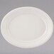 A white Tuxton oval china platter with an embossed pattern on the edge.