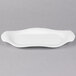 A white porcelain oval platter with fluted edges.