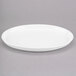 A white Libbey porcelain tray with an oval rim.