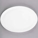 A white Libbey oval porcelain tray with a white rim.
