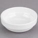A Libbey Royal Rideau white porcelain fruit bowl on a gray surface.