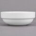 A Libbey Royal Rideau white porcelain fruit bowl on a gray surface.