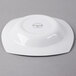 A Libbey Royal Rideau white square porcelain deep rimmed soup bowl on a gray surface.