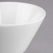 A Libbey Royal Rideau white porcelain bouillon bowl on a gray surface.