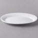 A white Libbey porcelain oval platter on a gray background.