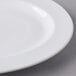 A close up of a Libbey white porcelain platter with a wide rim.