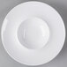 A close-up of a white Libbey Royal Rideau porcelain bowl with a white rim.