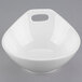 A white Libbey porcelain bowl with a handle.