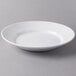 A Libbey Royal Rideau white porcelain entree and pasta bowl with a rim.