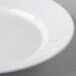 A close-up of a Libbey Royal Rideau white porcelain entree and pasta bowl with a white rim.