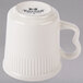 A white Tuxton Hampshire china mug with a black handle.