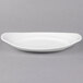 A white porcelain platter with an oval shape and a small rim.